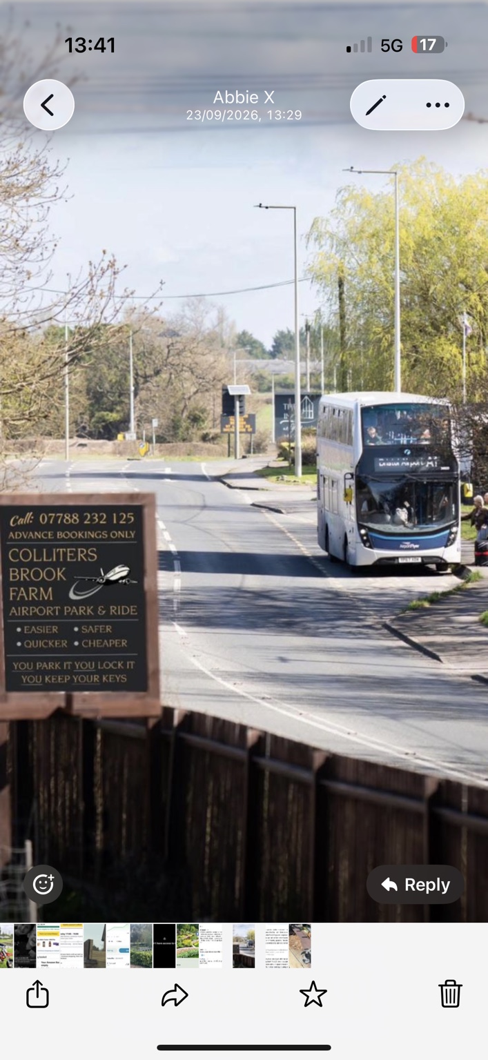 Airport flyer bus passing the Colliters Brook Farm sign outside the farm